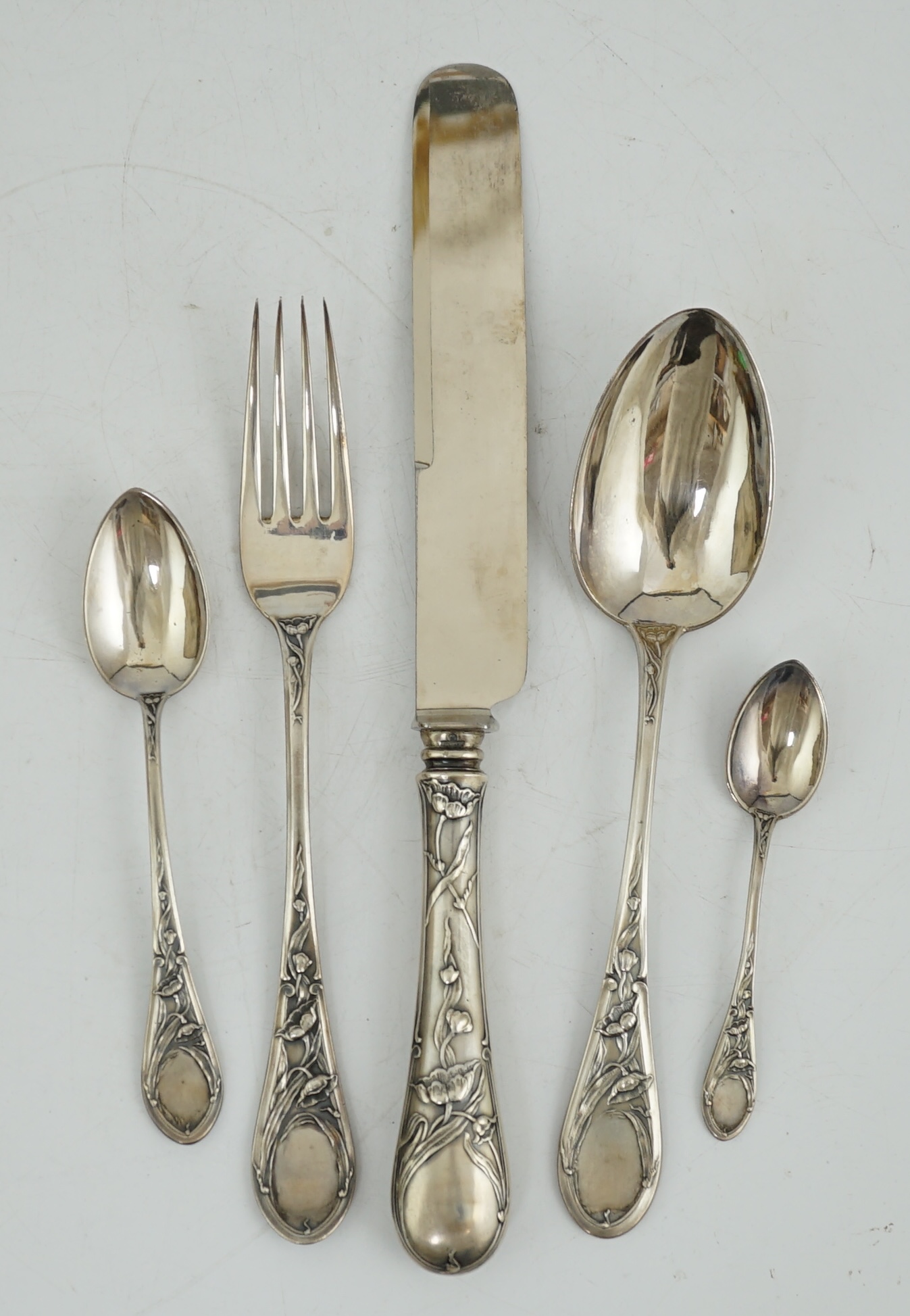 An early 20th century Russian 84 zolotnik silver five piece personal cutlery set by Ivan Khlebnikov